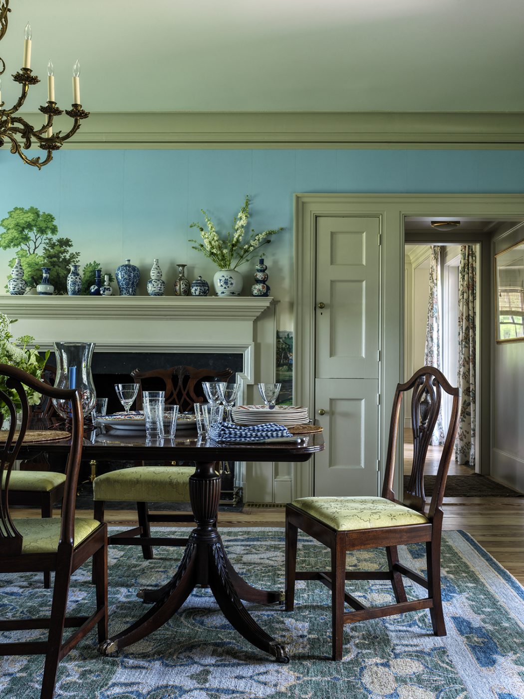 dining room of an 18th-century farmhouse restored and designed by Hendricks Churchill ,with scenic wallpaper and antiques