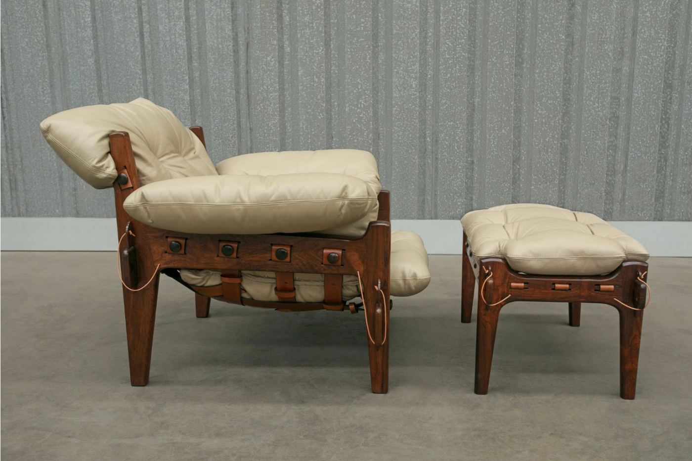 A 1963 SERGIO RODRIGUES Moleca armchair and footstool