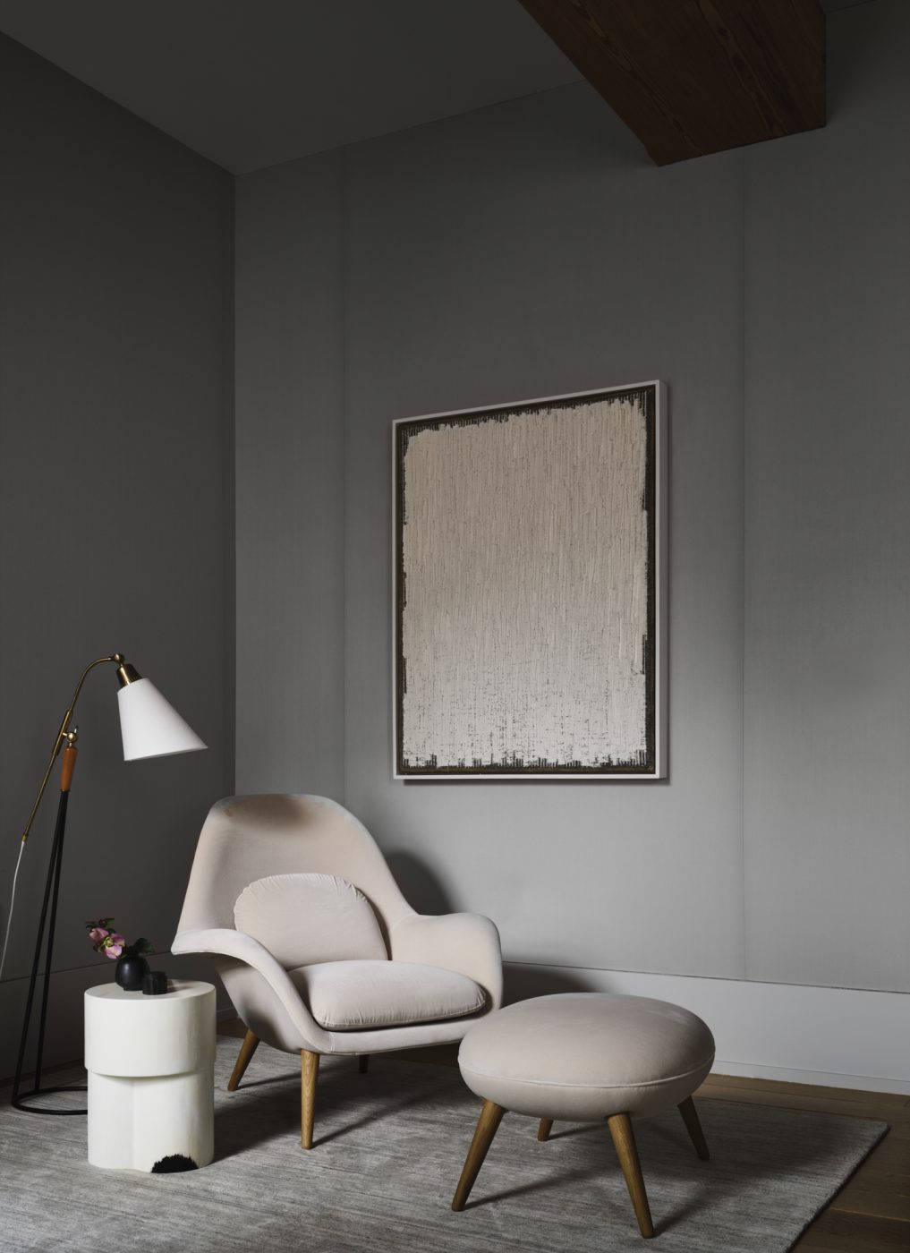 a reading corner of the primary bedroom of a Tribeca loft designed by Nicole Hollis