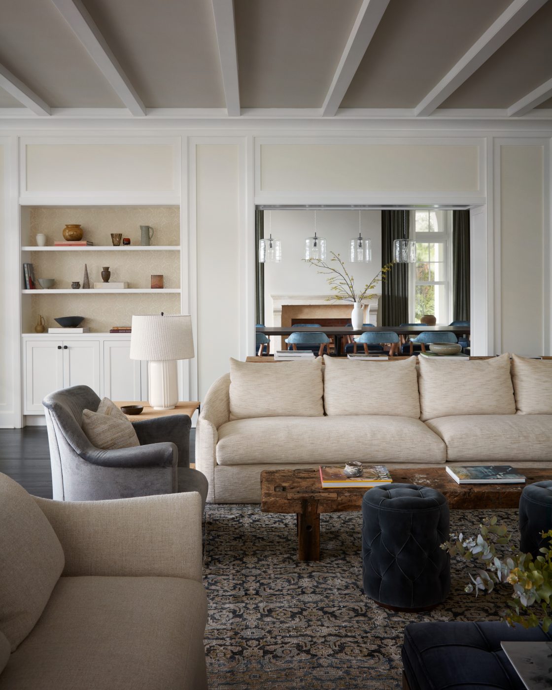 View of a Hamptons beach house living room designed by Charles & Co.