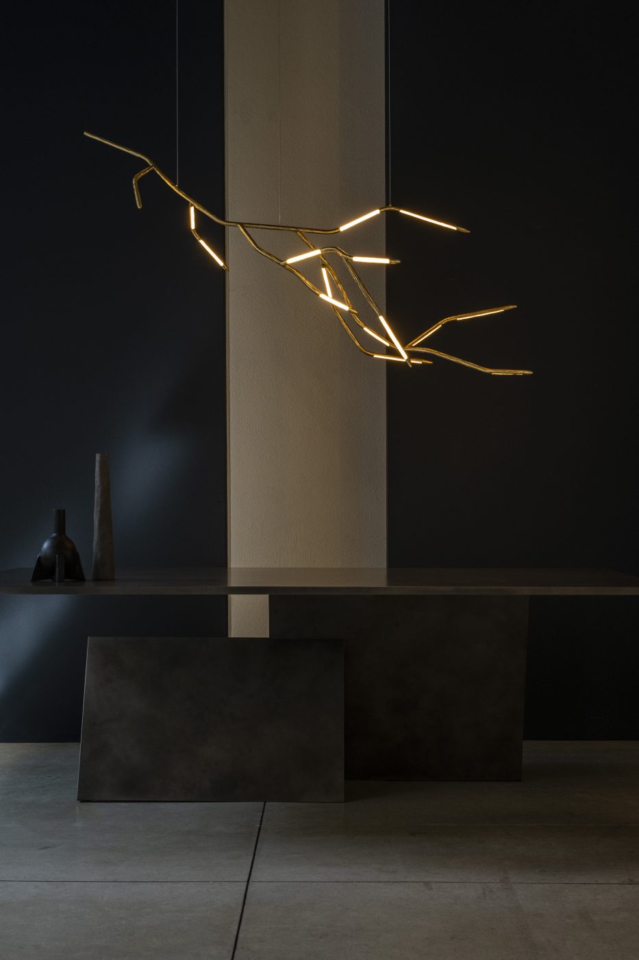 The Dafne chandelier by Morghen Studio, Y dining table by dAM Atelier, and bronze Duck Neck vase and candle pillar by Rick Owens, offered by Galerie Philia