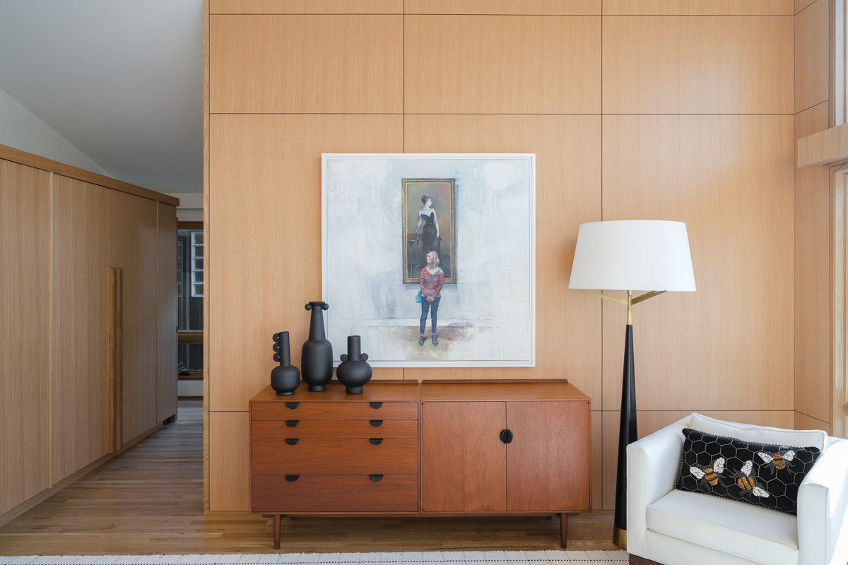 A Finn Juhl credenza in the primary bedroom of a mid-century-modern home designed by Susan Yeley