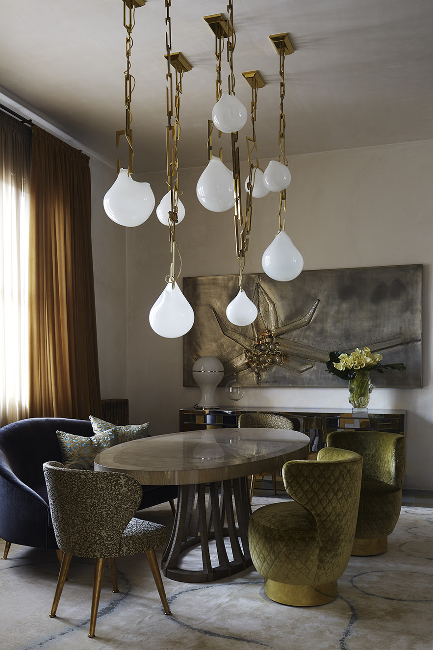 Christopher Boots's Nepenthes pendants hanging over a dining table