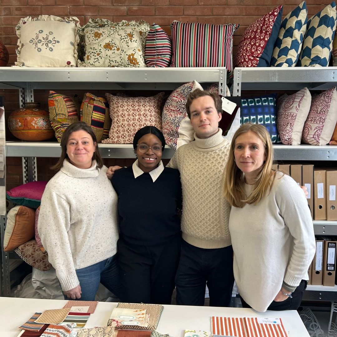 United in Design intern Aaliyah Oshodi poses with three coworkers at Kate Guinness Design.