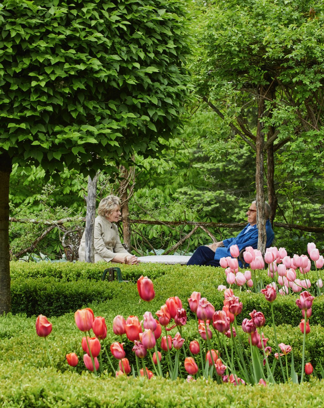 John Roselli and Bunny Williams in the parterre garden of their country home in northwest Connecticut