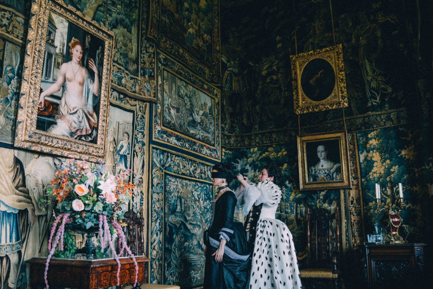 A still from the film The Favourite showing the tapestry-covered walls of the queen's bedroom 
