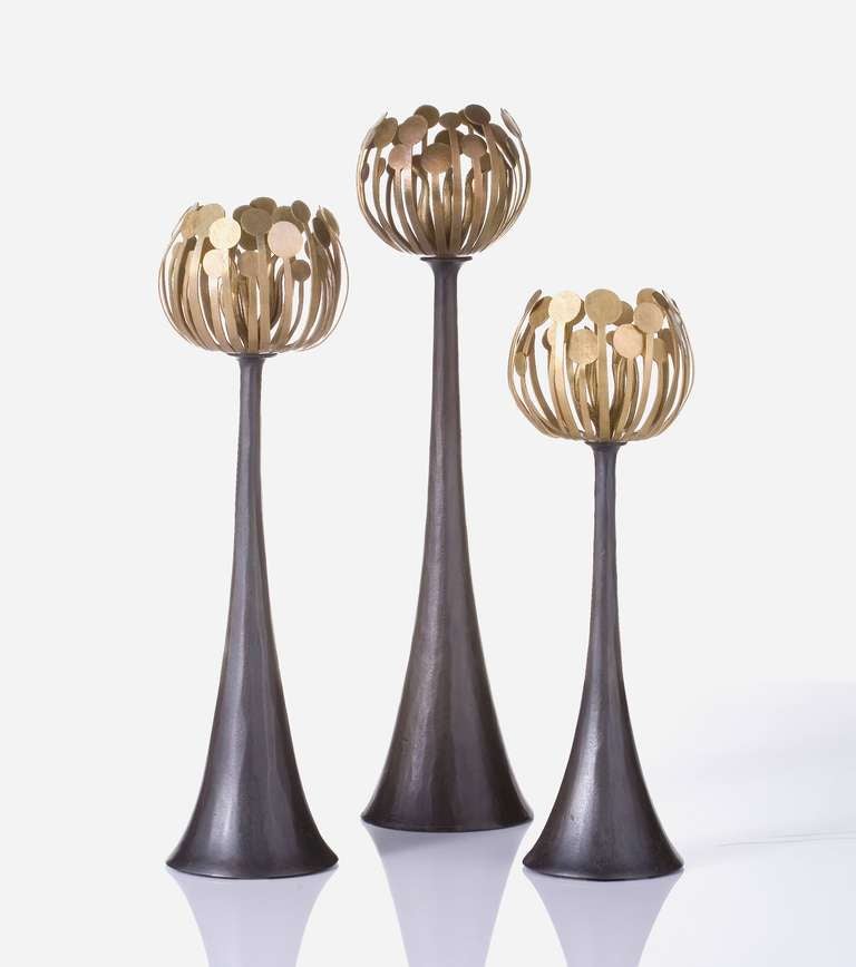 A trio of bronze Hervé Van der Straeten Pistil candleholders offered by Maison Gerard in New York