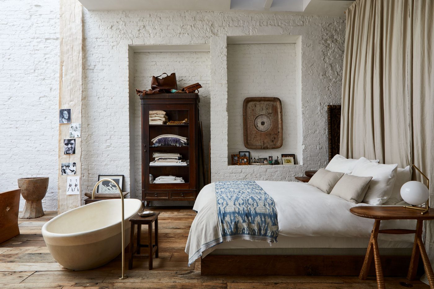The sleeping area and bathtub in the Soho loft of Andrianna Shamaris