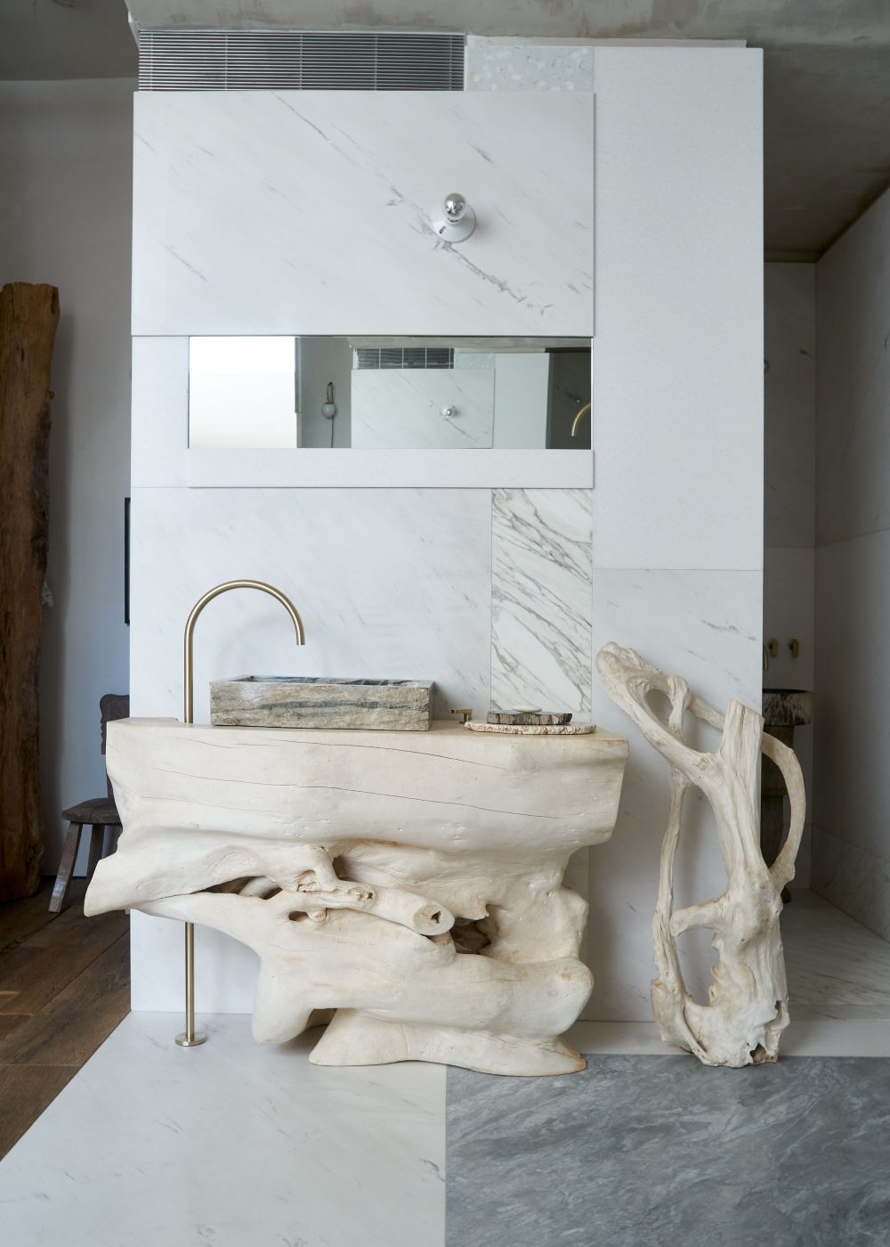 The teak bathroom sink in the Soho loft of Andrianna Shamaris