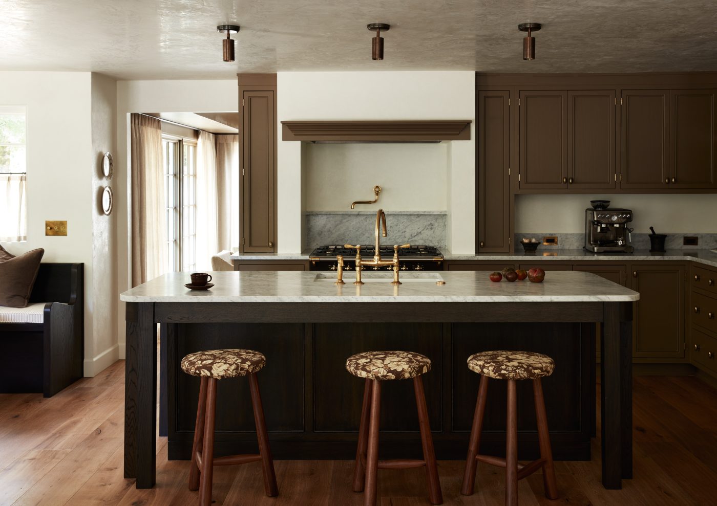 Stools with seats upholstered in Ralph Lauren botanical fabric in kitchen of interior designer Molly Beth Kidd's Oregon home