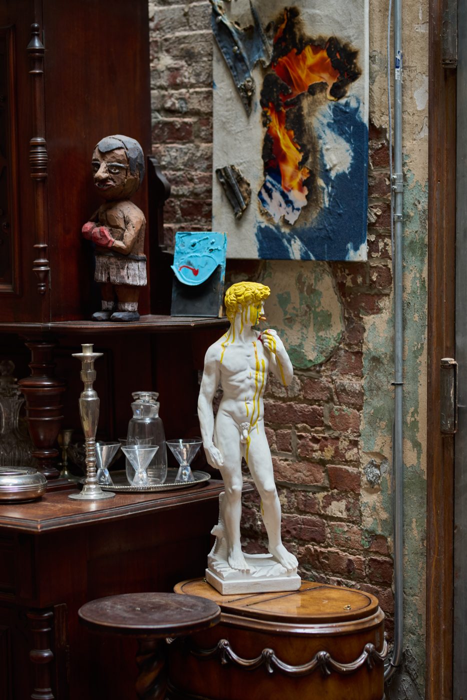 Living area of Ray Smith home in his Brooklyn studio, displaying artworks by Bruce High Quality, Eamon Monaghan, Rhys Gaetano and Korakrit Arunanondchai.