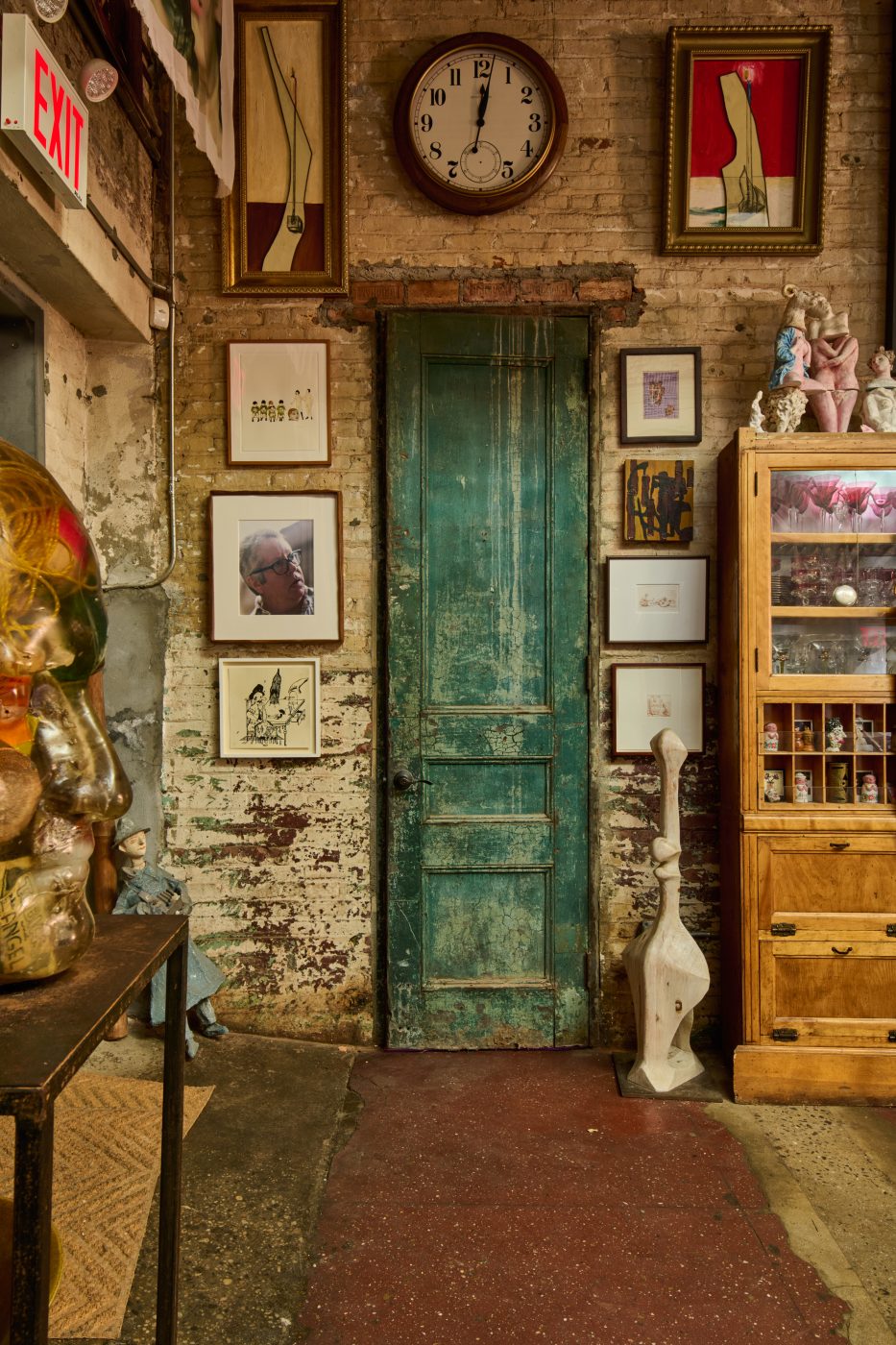 Artist Ray Smith home in his Brooklyn studio, fitted with two kidney shaped sofas and filled with art and objects