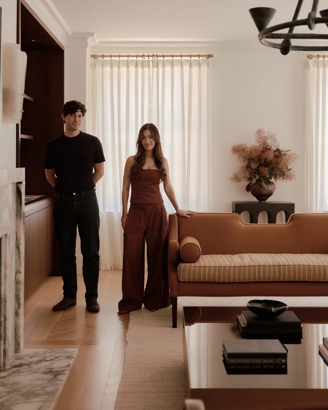 Portrait of Beaudry Collier Designs founders and principles Cassandra Beaudry and Alexander Collier photographed in the living room of a maisonette home they designed on Park Avenue on Manhattan's Upper East Side