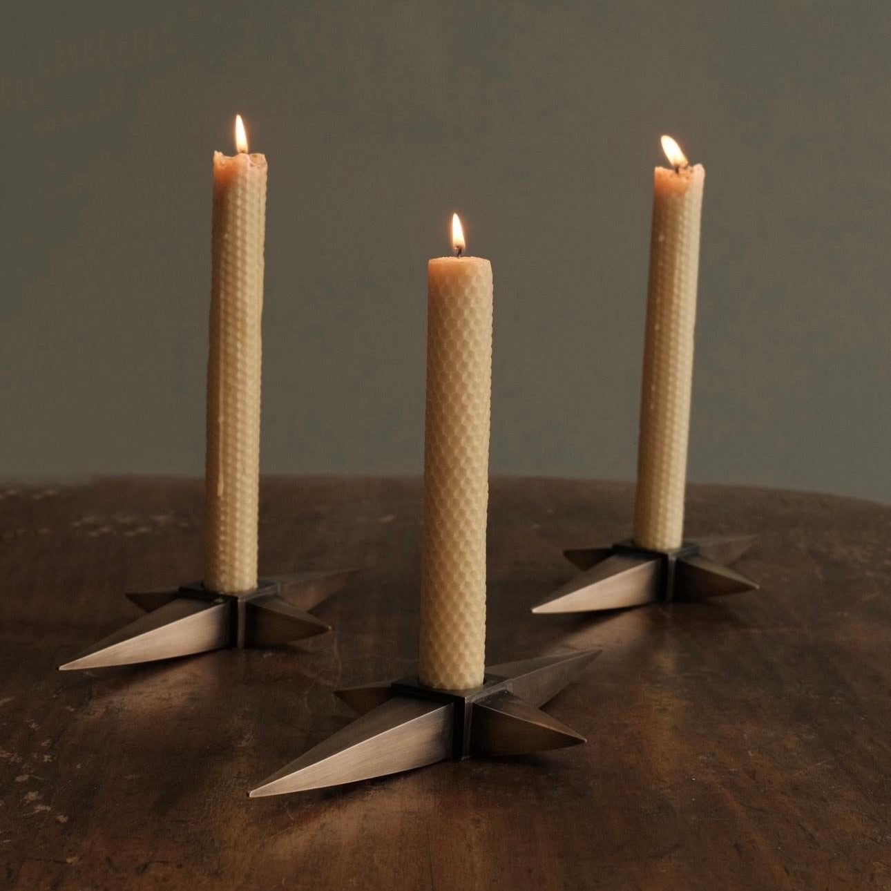 Compass candlestick holders at Los Angeles furniture gallery Blackman Cruz