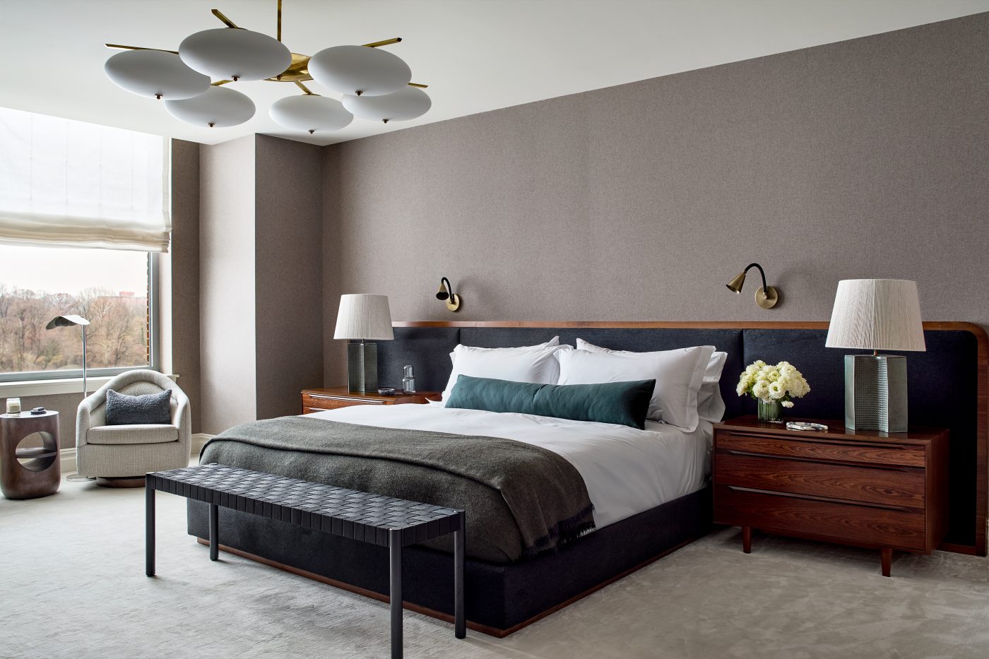 Primary bedroom with gray wool-upholstered walls in Washington DC Georgetown penthouse apartment by interior designer Zoë Feldman