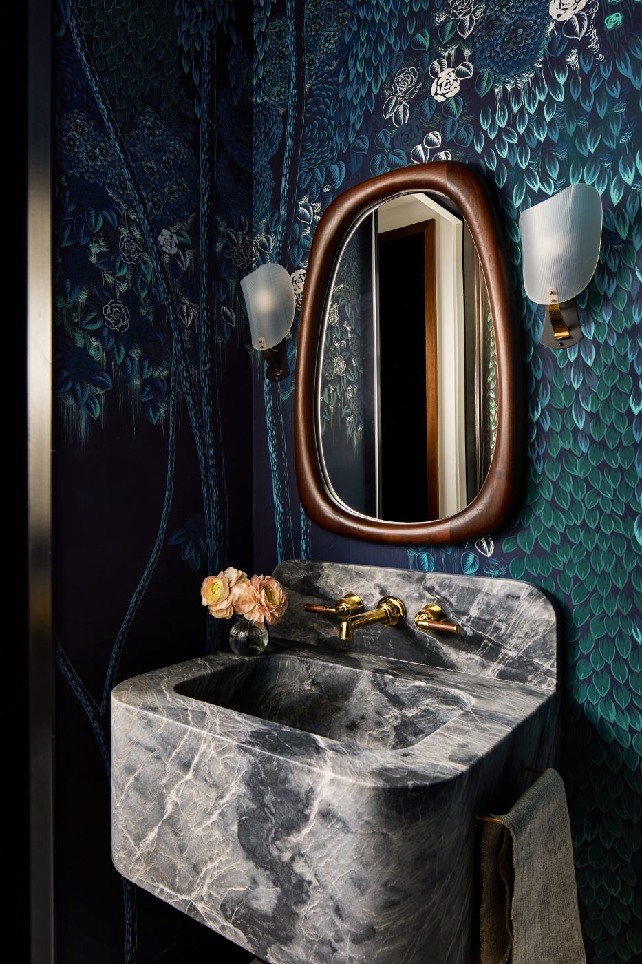 Powder room with dark green and blue botanical wallpaper in Washington DC Georgetown penthouse apartment by interior designer Zoë Feldman
