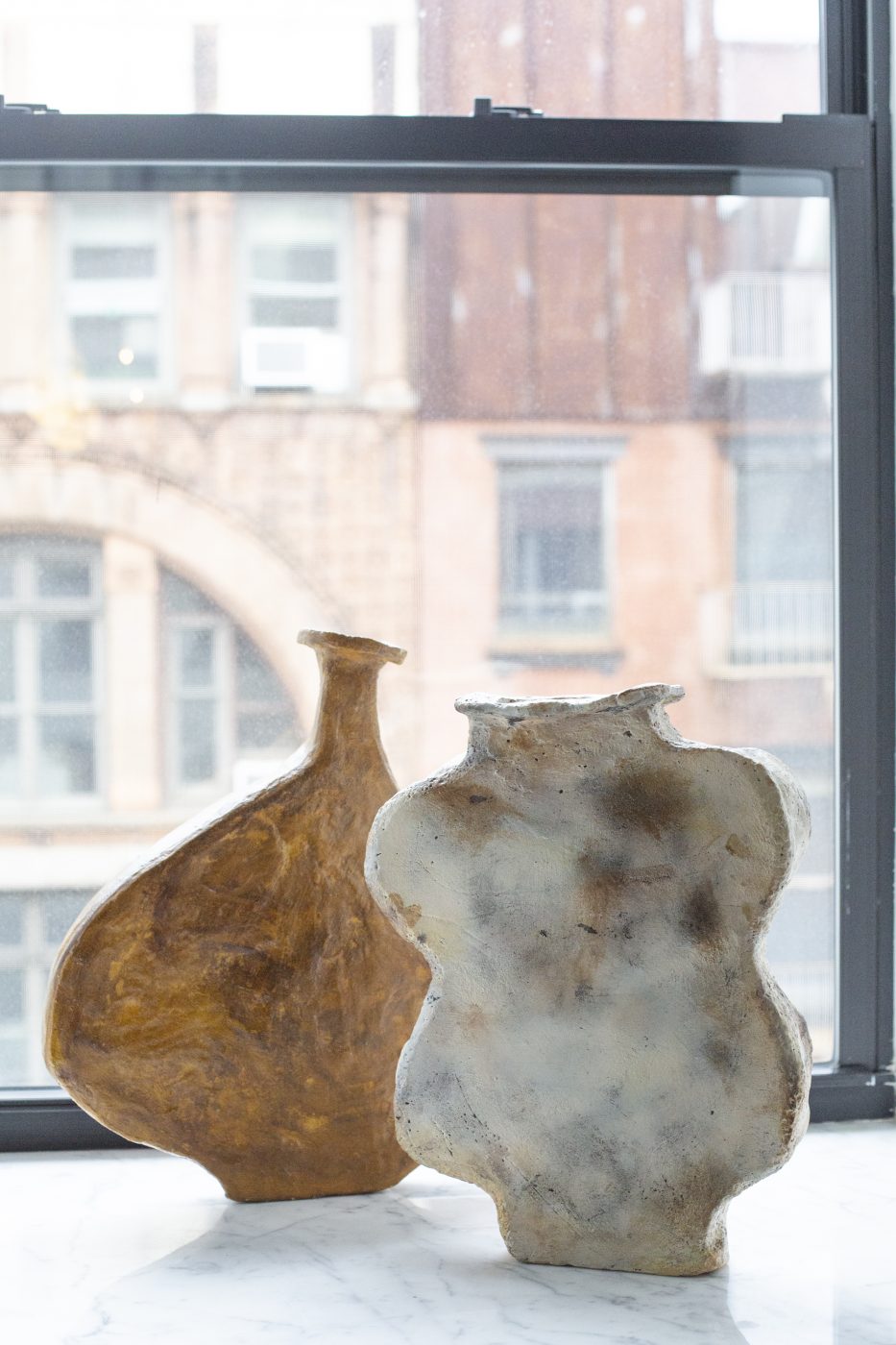 A pair of Willem van Hooff vases on a window sill at Galerie Philia