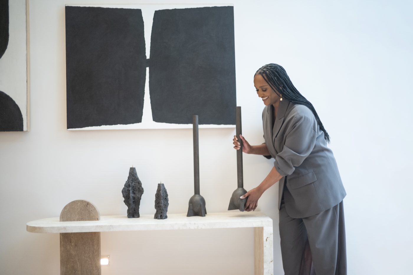 Interior designer Randall Jones holding a Rick Owens Swan Neck vase at Galerie Philia