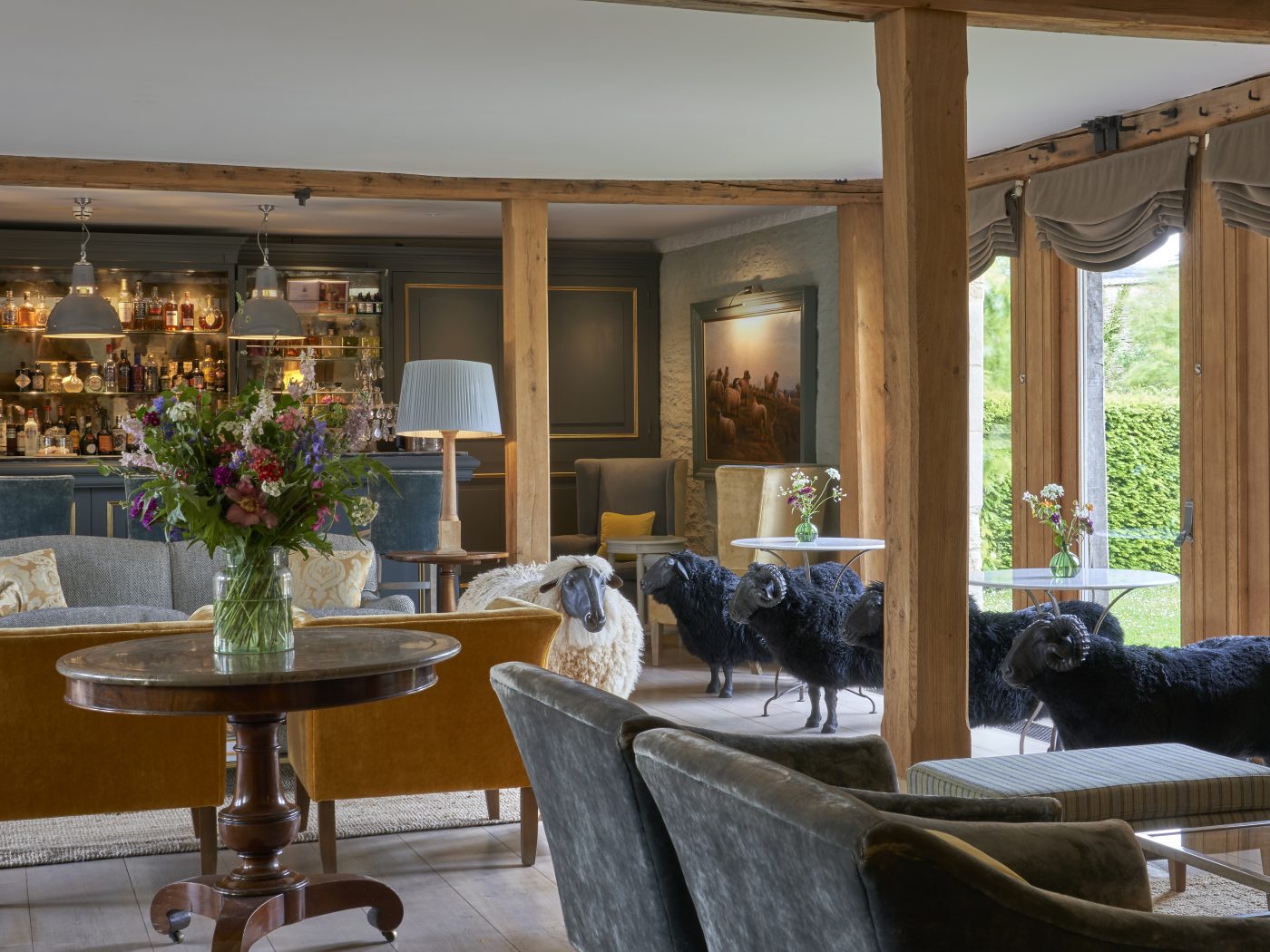 Baa Bar dotted with sheep sculptures at the Thyme countryside hotel and estate in England's Cotswolds 