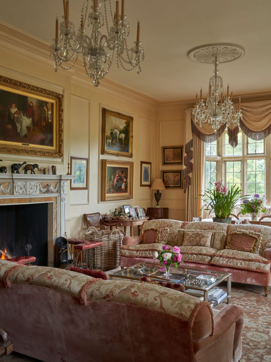 The antique-filled classicaly decorated drawing room of the Manor House of the Hibbert family, founders of the Thyme countryside hotel and estate in England's Cotswolds 