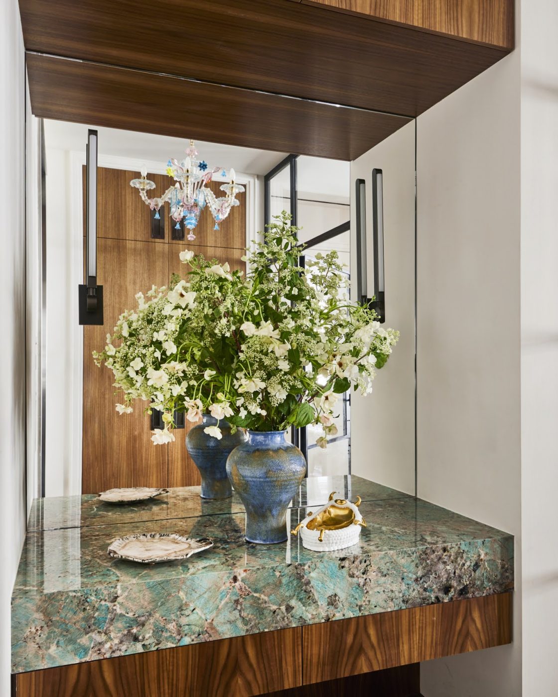 Mirror-back niche in entry hall of Tribeca loft Interior by designer Kati Curtis
