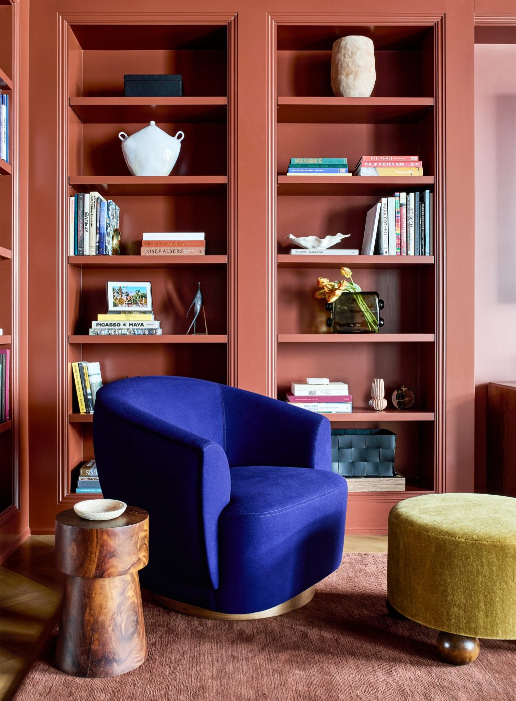 Terracotta-colored den in Washington DC Georgetown penthouse apartment by interior designer Zoë Feldman