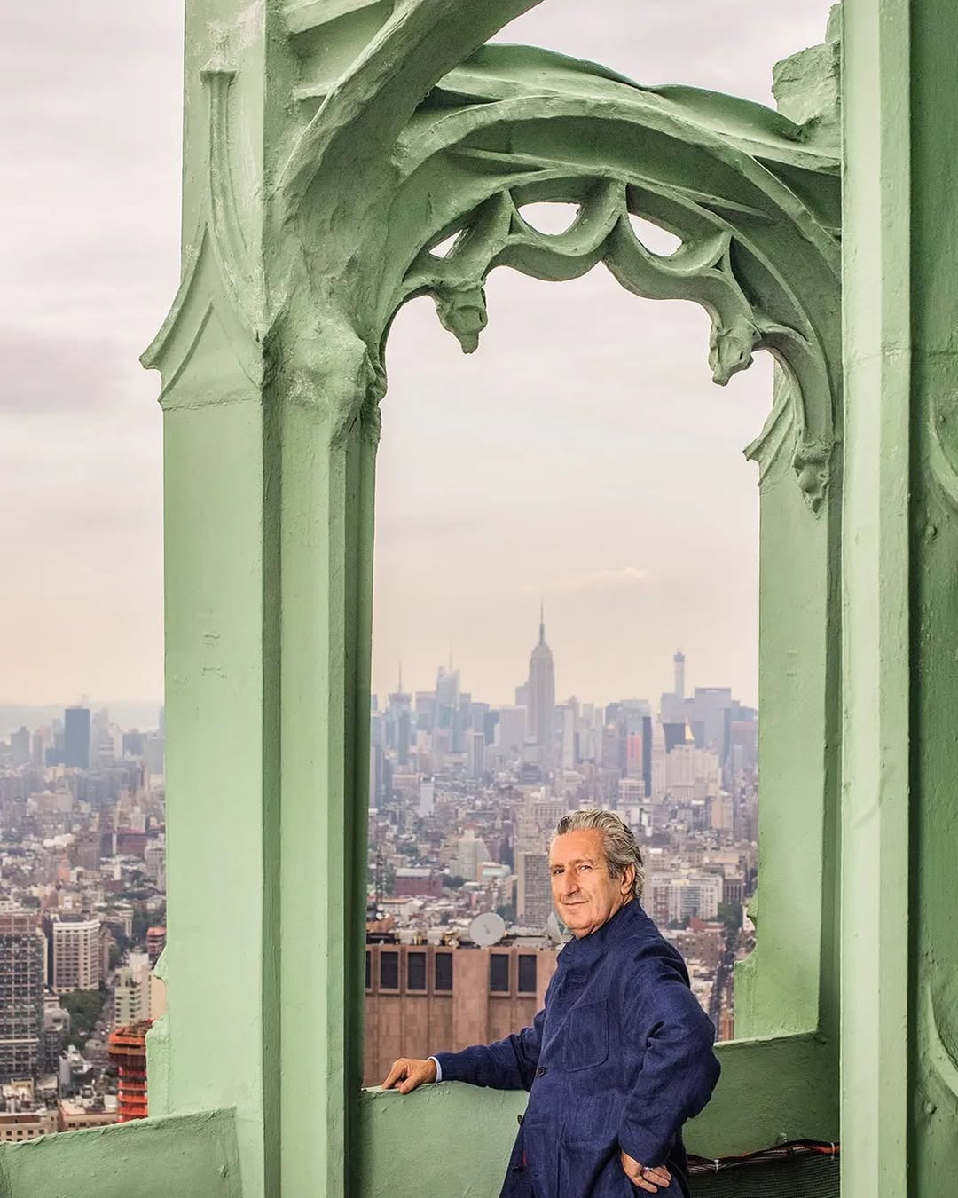 Architect Thierry Despont standing on top of the Woolworth Building in Manhattan
