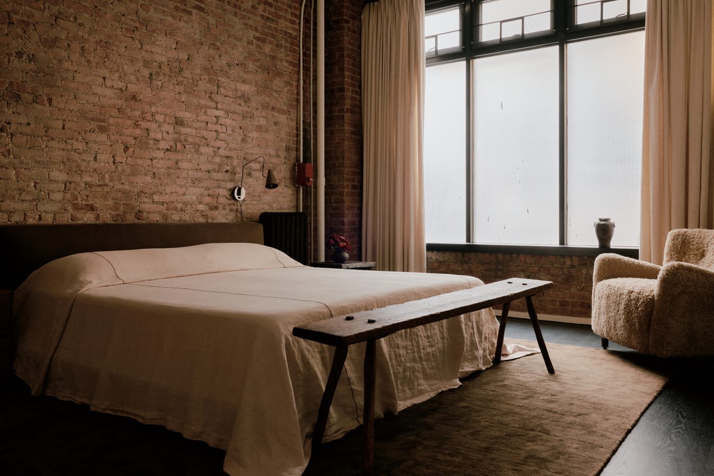 primary bedroom in Flatiron District loft in New York City Manhattan designed by Lauren Garrett's firm LP Creative