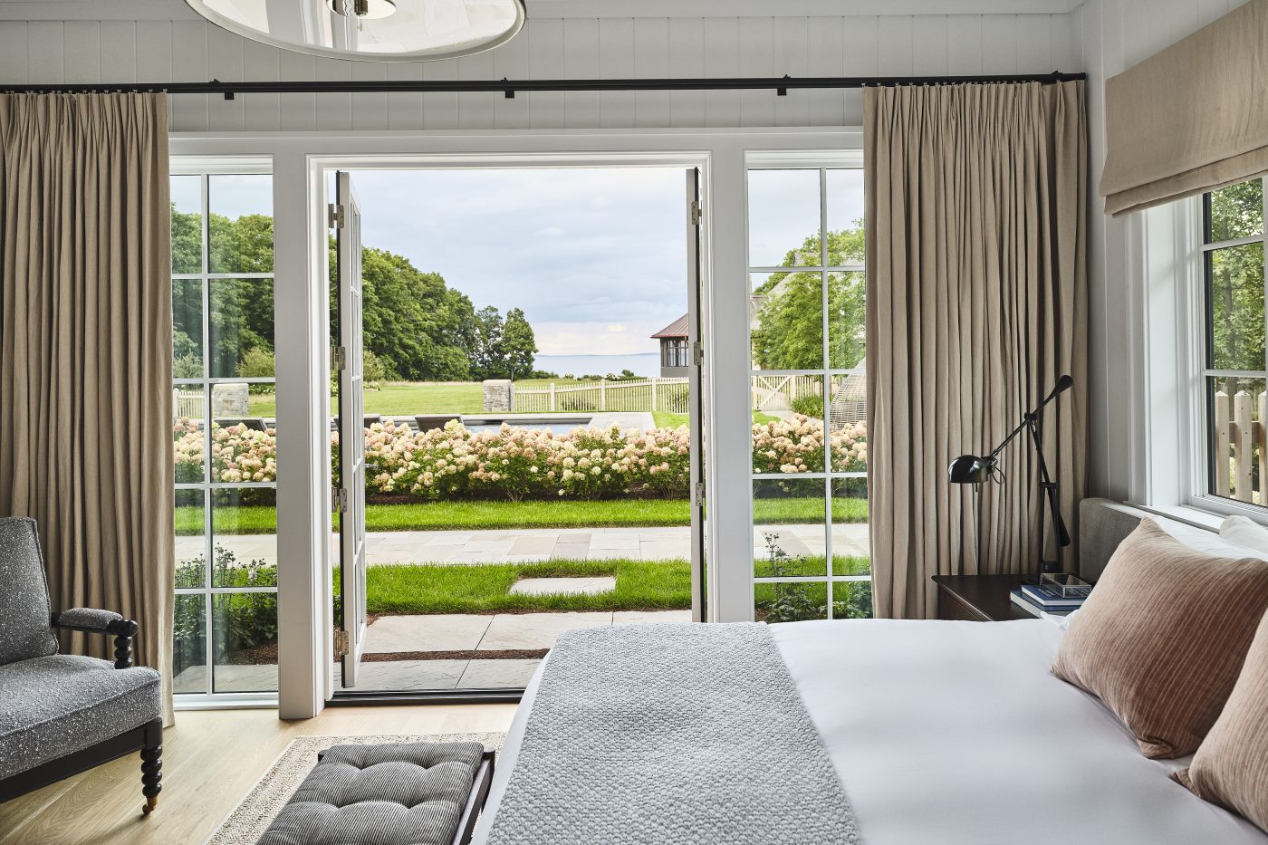 Pool house bedroom of a Maine coast home designed by Gray Davis and Will Meyer of the studio Meyer Davis