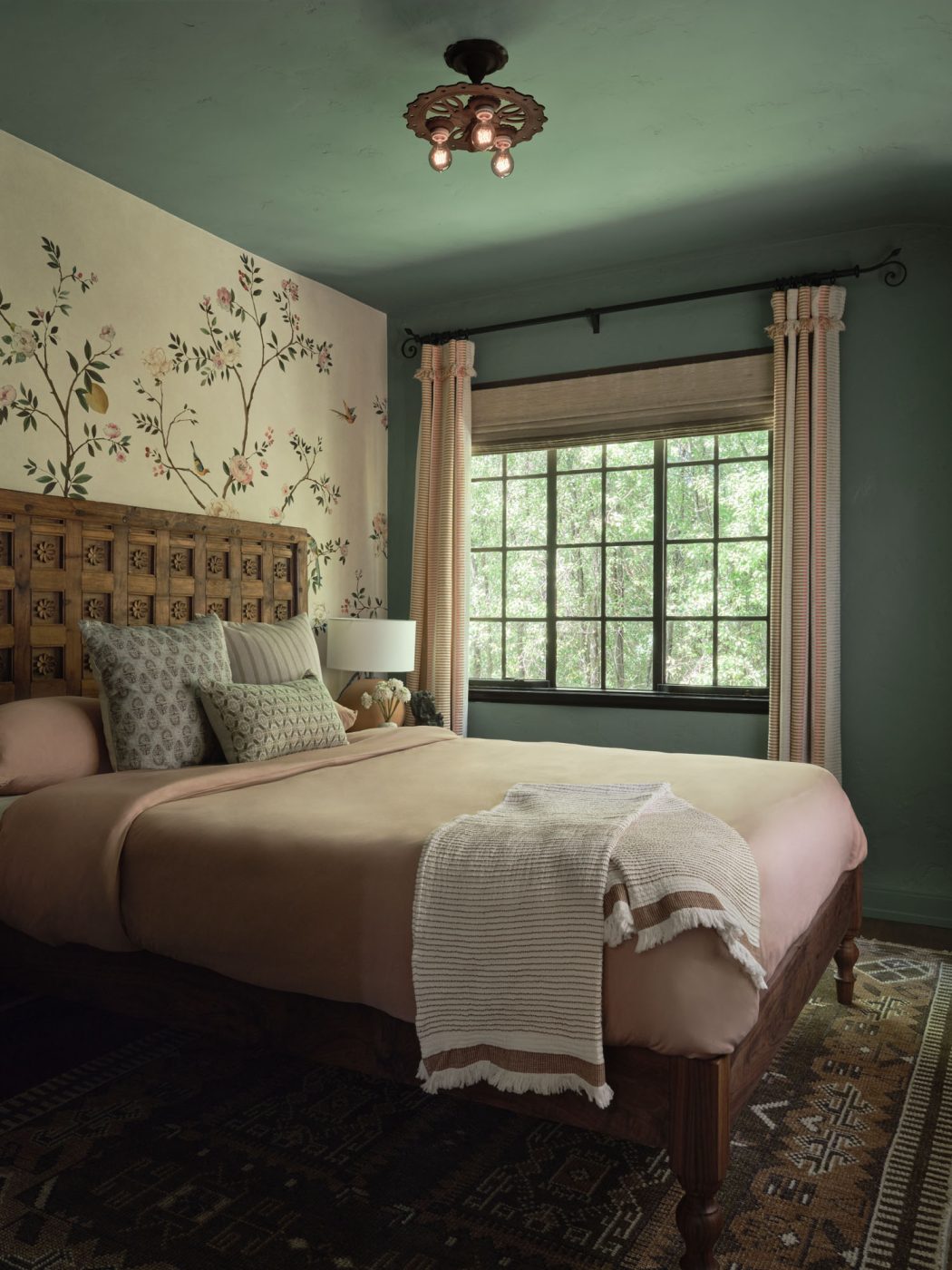 Bedroom with headboard made of an old wood door in Palo Alto Silicon Valley California Mediterranean house designed by Mandy Cheng
