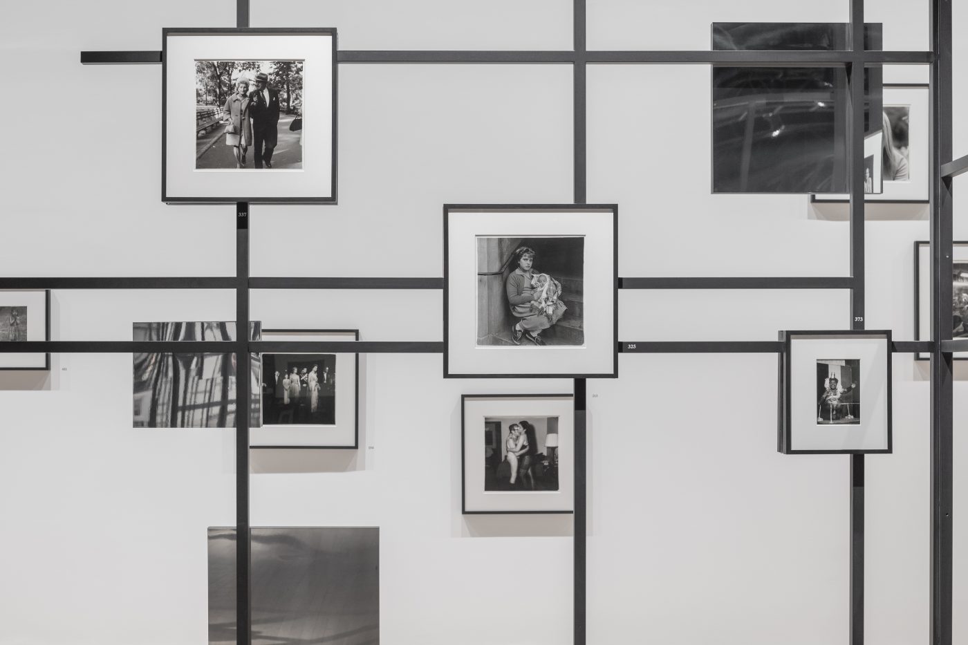 An installation view of the photography exhibition "Diane Arbus: Constellation" at the Park Avenue Armory in New York City