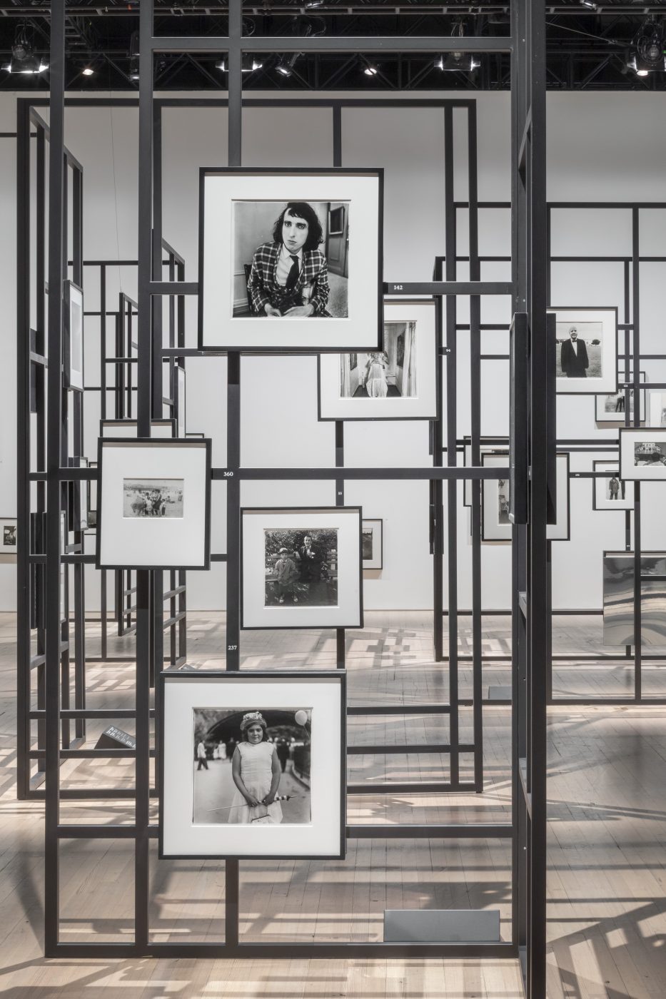 An installation view of the photography exhibition "Diane Arbus: Constellation" at the Park Avenue Armory in New York City
