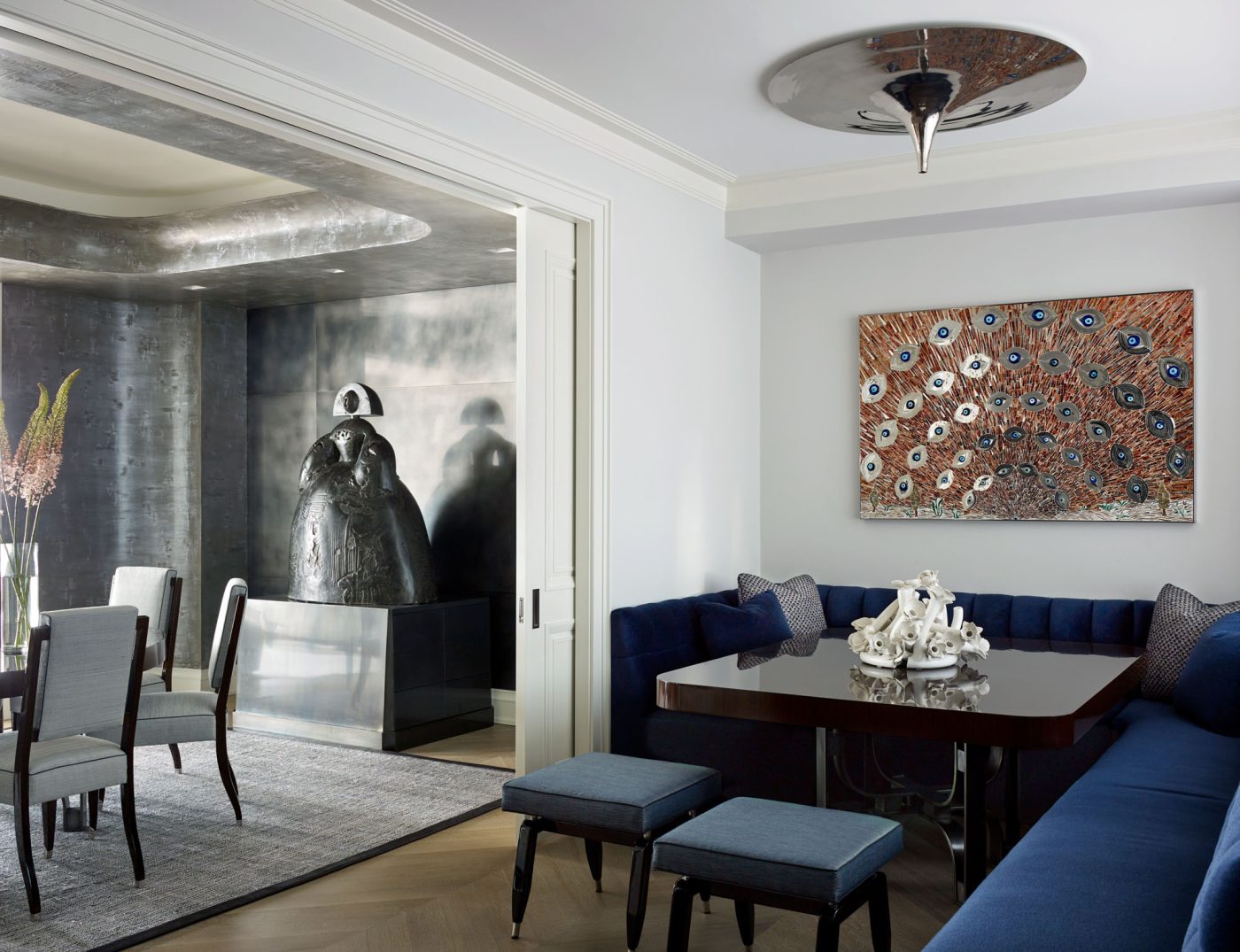 Breakfast nook with blue corner banquette in Fifth Avenue Manhattan apartment designed by David Kleinberg