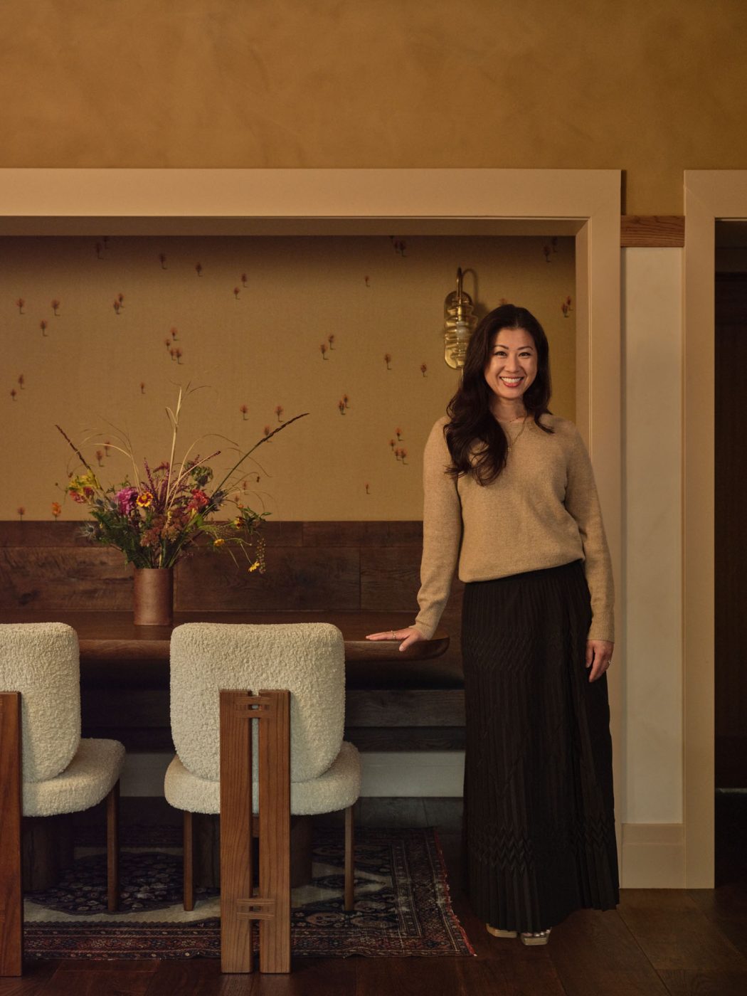 Interior designer Mandy Cheng portrait in breakfast nook of Palo Alto Mediterranean house Northern California