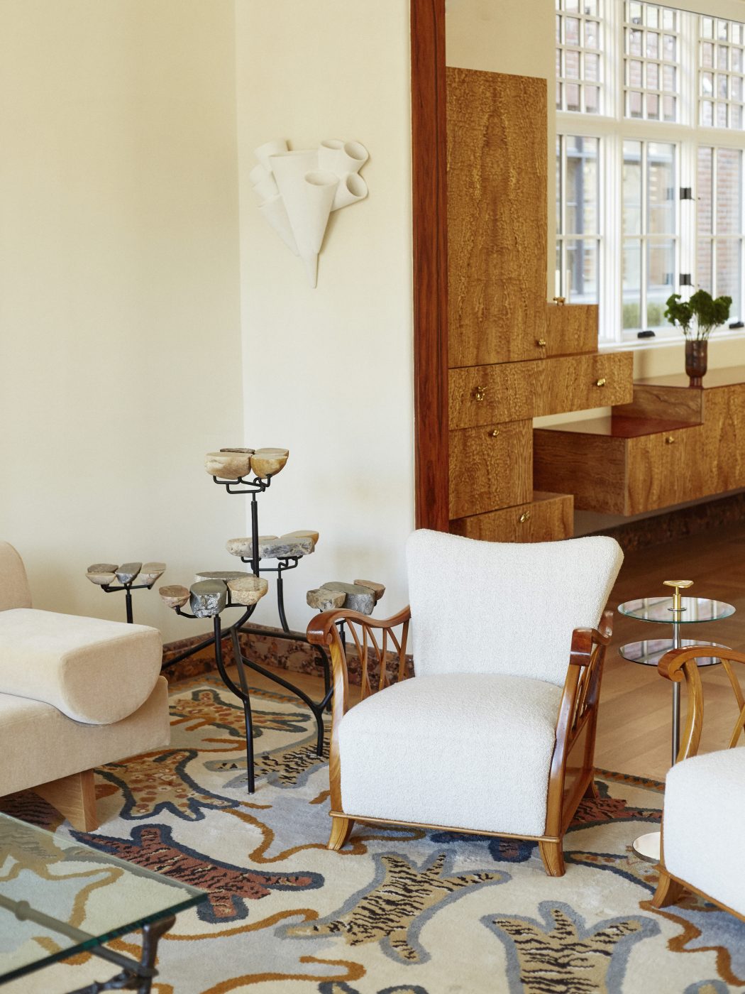 Maurizio Tempestini vintage armchair and Roberto Giulio Rida side table in living room of Brooklyn's Gravesend neighborhood with interior design by Eli Dweck 