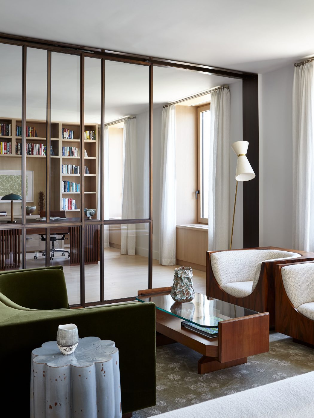 great-room seating area in front of glass-fronted office in Tribeca Manhattan New York loft designed by Damon Liss
