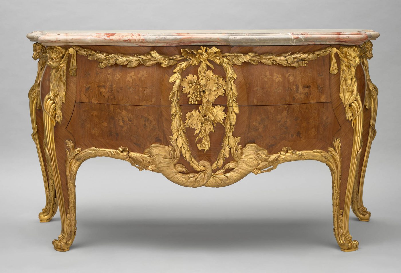A marble-topped commode with marquetry and gilt-brass accents by French maker François Linke