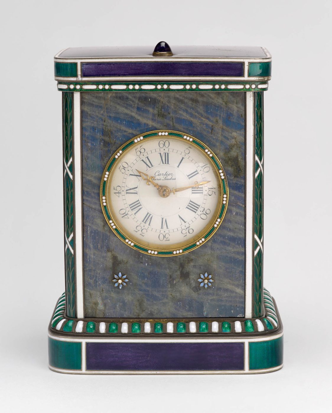 A Cartier desk clock decorated with gold, labradorite and enamel