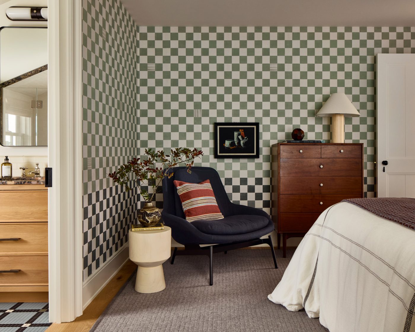 Both of the boys’ rooms sport Schumacher’s checkerboard Gambit Panel wallpaper in different hues. This one is in green, foregrounded by a Kipp Stewart for Drexel dresser.