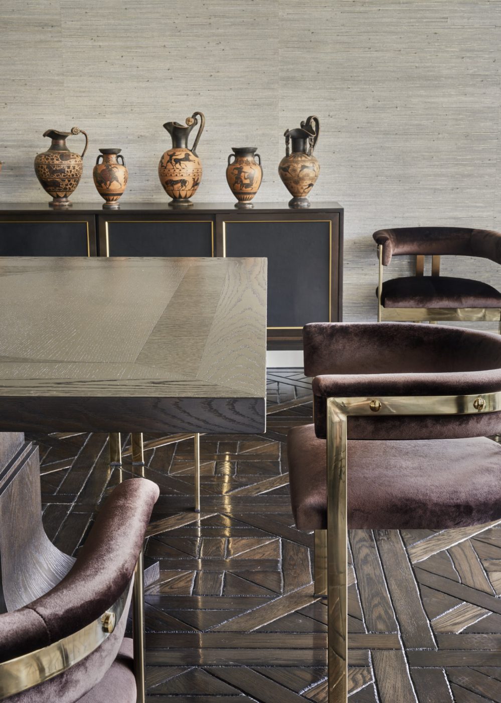 Also in the dining room:  ancient Greek v​ases once owned by Gianni Versace​​ atop a vintage Edward Wormley credenza from 1stDibs​.