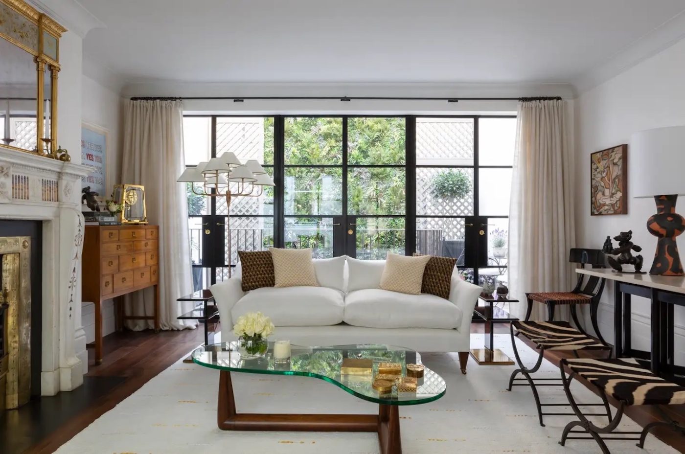 A Jean Royère floor lamp in the drawing room of a London townhouse designed by Bryan O’Sullivan.