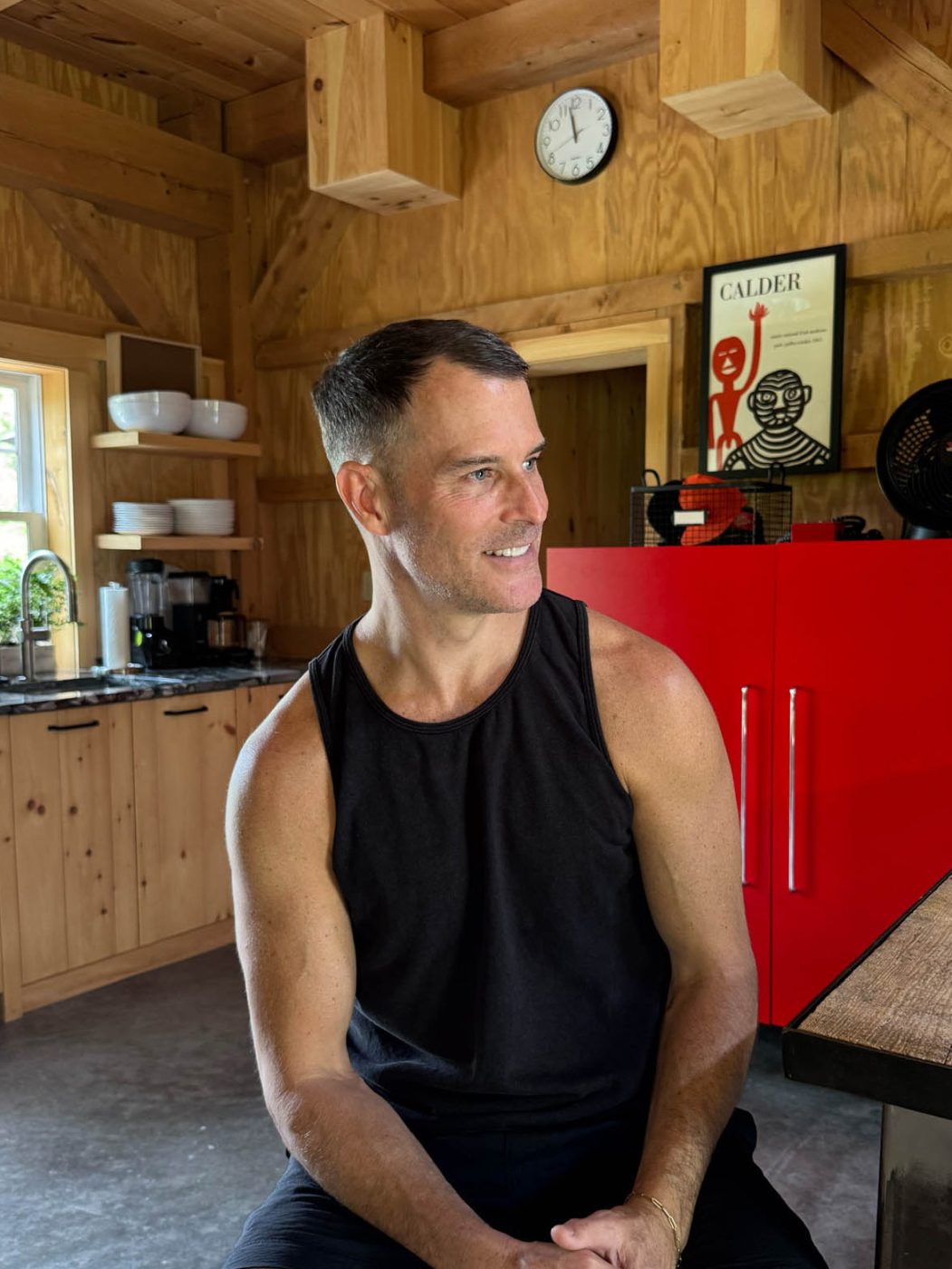 Shawn Henderson in the kitchenette of the converted-barn suite next to his 1830 country house in Hillsdale, New York.