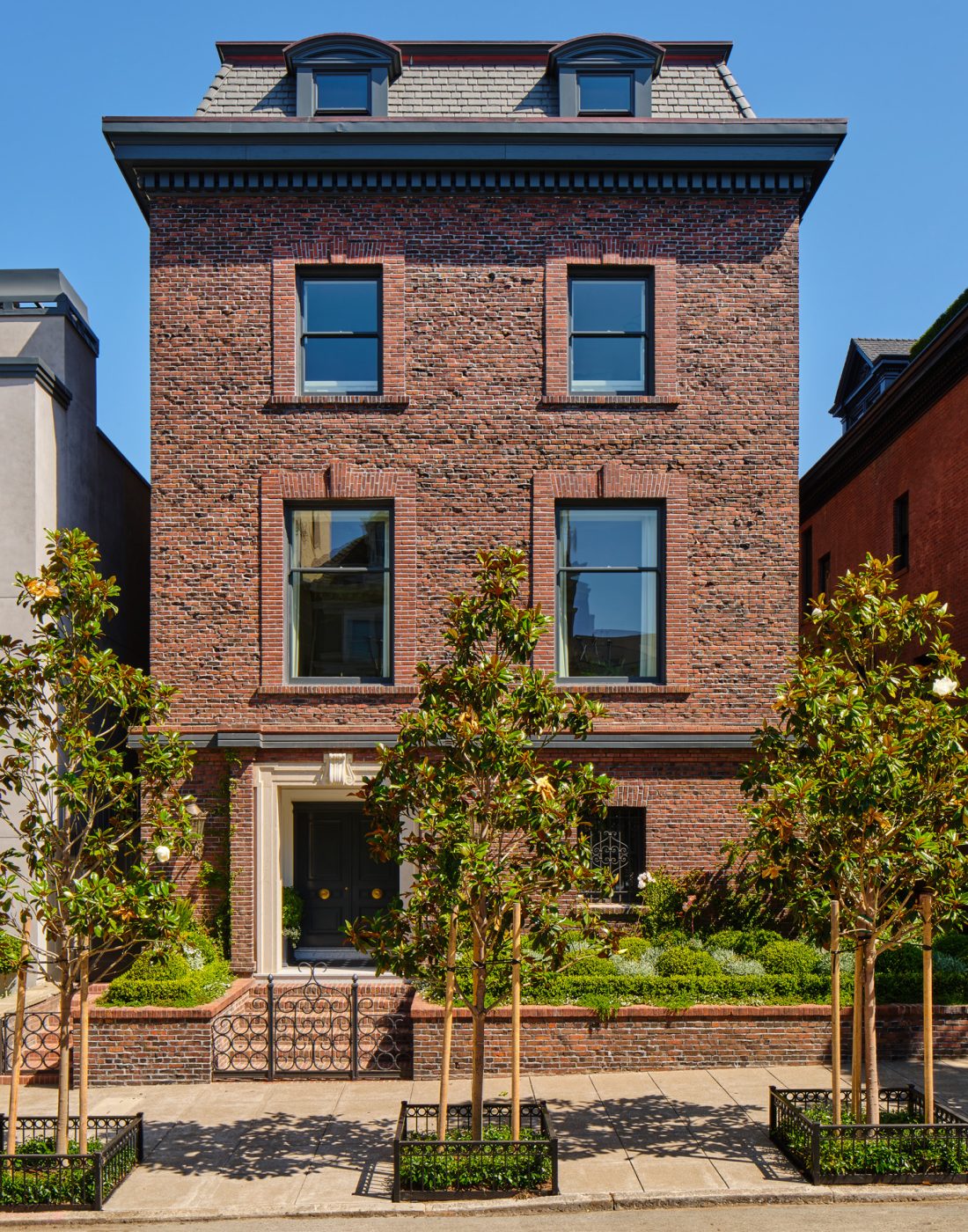 Brick exterior of Edwardian style mansard roof house in San Francisco's Pacific Heights neighborhood recently given new interiors by Brittany Giannone's ABD STUDIO