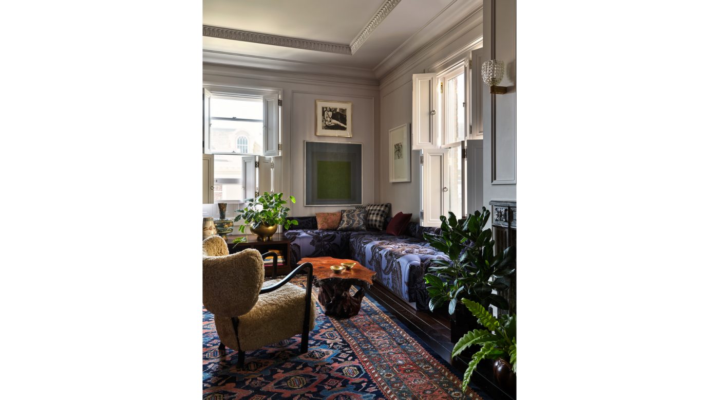 Art filled corner banquette area in the primary bedroom of an Edwardian house San Francisco's Pacific Heights with interiors by Brittany Giannone's ABD STUDIO