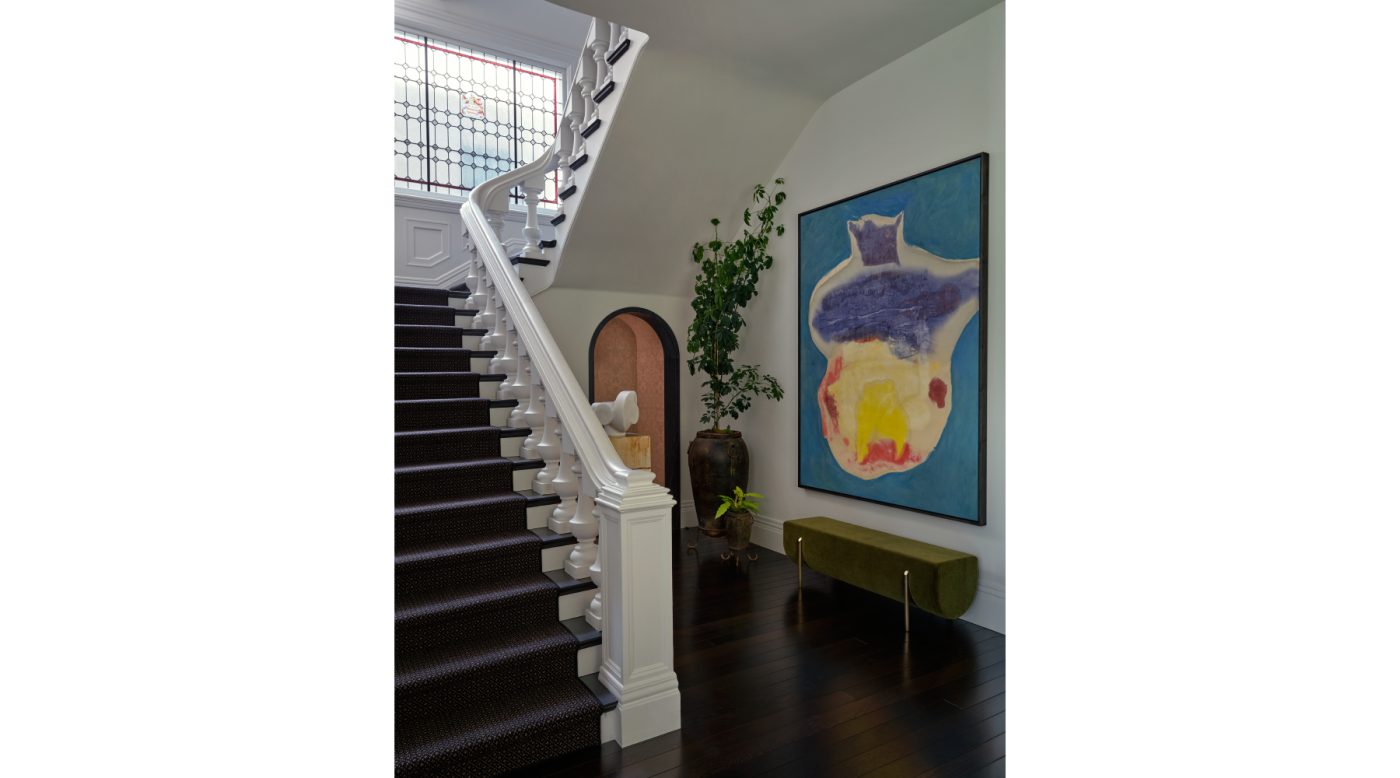 Helen Frankenthaler at the base of the stairs in an Edwardian house San Francisco's Pacific Heights with interiors by Brittany Giannone's ABD STUDIO