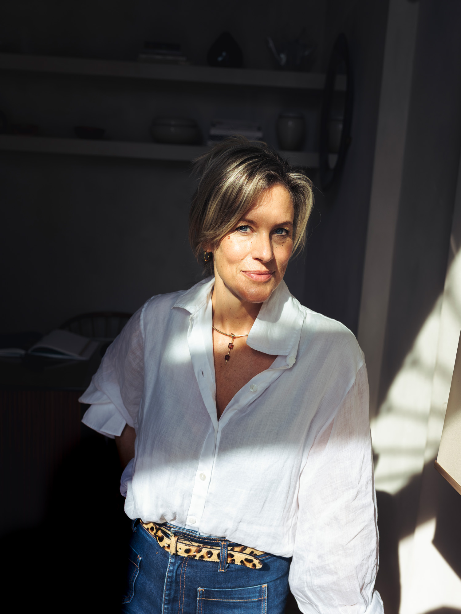 Antiques dealer Bec Astley Clarke portrait photographed in her shop The Italian Collector in Florence, Italy's Oltrarno neighborhood