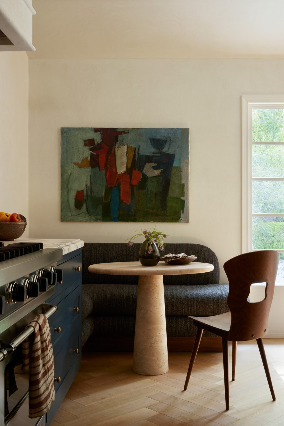 Athena Calderone-inspired kitchen in Beverly Hills home designed by Maggie Smith with art from Eneby Home and chair from Baumann France