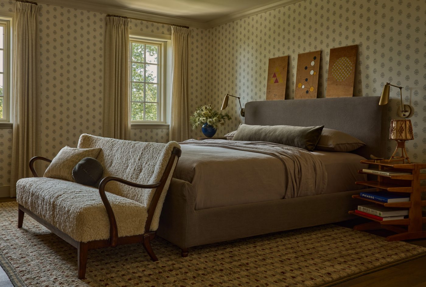 Alfred Christensen shearling bench at the foot of the custom bed in a guest bedroom of a 1912 Colonial-style home redesigned by Autumn Oser and Andre Golsorkhi, partners in the design firm Haldon House