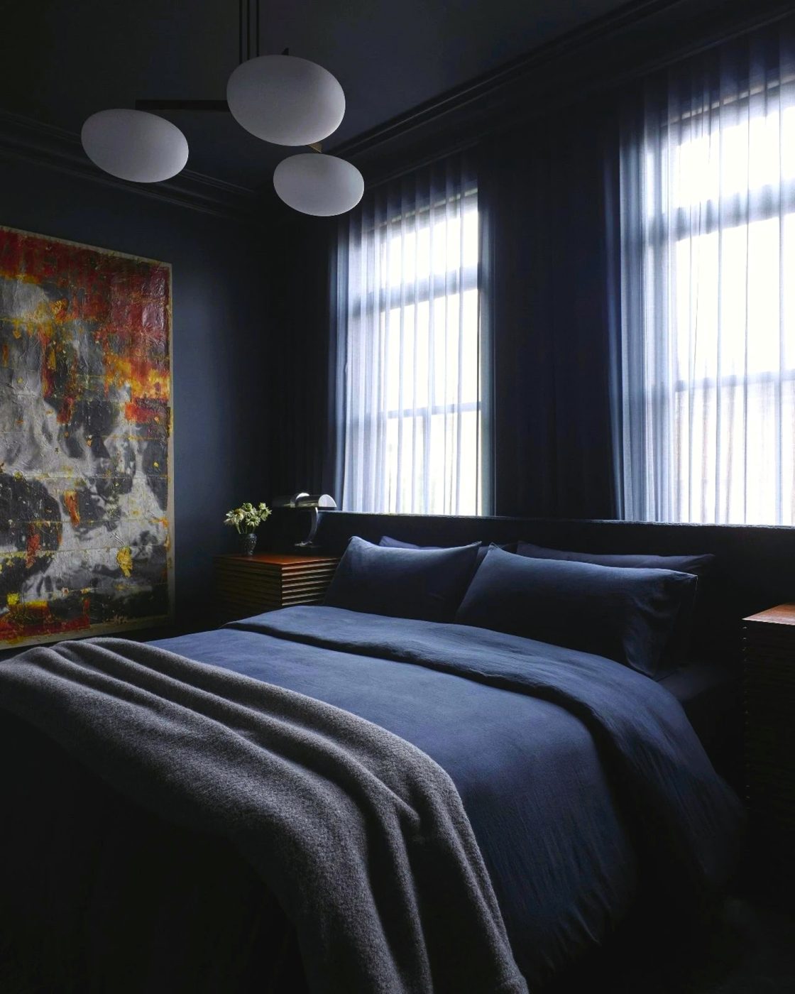 Allover dark blue bedrooms in a Harlem townhouse designed by Crystal Sinclair