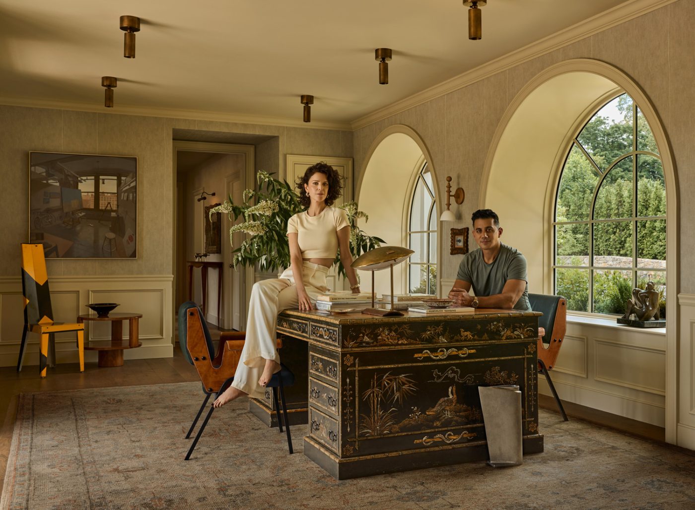 Portrait of Autumn Oser and Andre Golsorkhi, partners in the design firm Haldon House, seated in the office of a recently finished Colonial-style home they redesigning on Philadelphia's main line